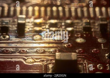 Texture or background created with electronic elements coming from an electronic board with printed circuit boards. Stock Photo