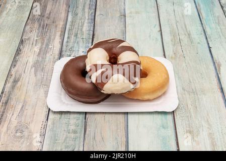 There are many types of donuts: some are glazed with various colors and sometimes they have sprinkles Stock Photo
