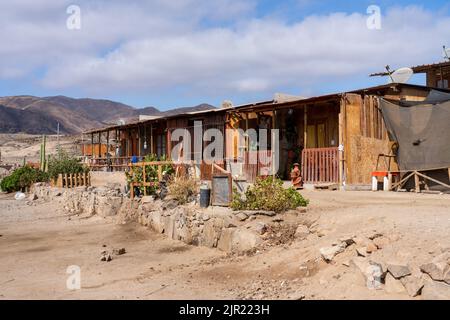 Fishermen's houses in Caleta Pan de Azucar, Pan de Azucar National Park in the Atacama Desert of Chile. Stock Photo