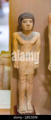 Cairo, Egyptian Museum, statuette of the son of Kanakht, in limestone, from Gizeh. Stock Photo