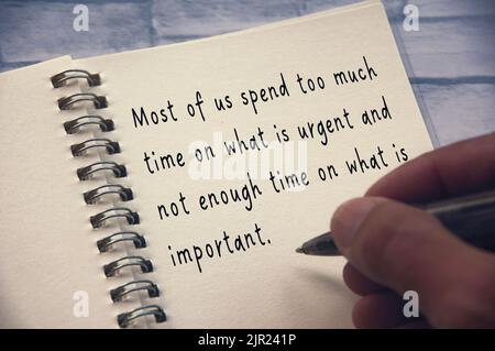 Life inspirational quote - Most of us spend too much time on what is urgent and not enough time on what is important. Inspirational concept. Stock Photo