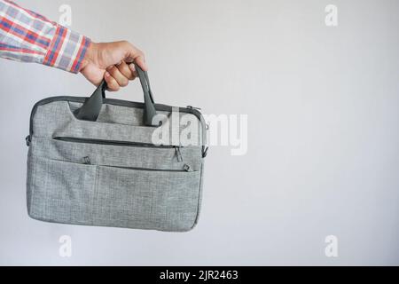 young man holding a shoulder bag  Stock Photo