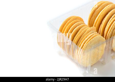 Round Crackers biscuits in plastic box isolated on white background, Dry cracker cookies isolated, snack and fastfood concept Stock Photo