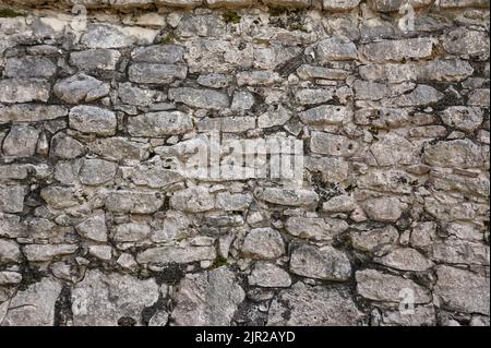 Texture of natural stones forming a wall. Stock Photo