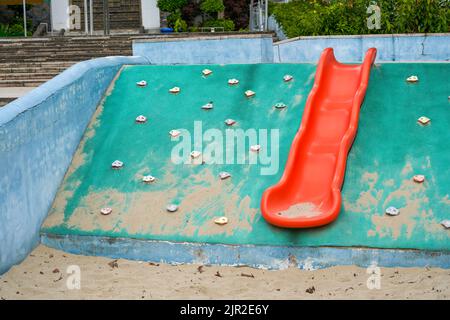 Play sand pool and slides in children's playground Stock Photo