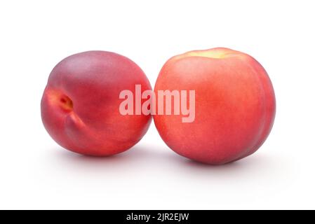 Two ripe fresh nectarines isolated on white. Stock Photo