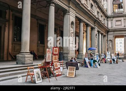 A street artist presenting their art around Uffizi Gallery in Florence, Italy Stock Photo