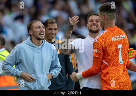 Leeds, UK. 21st Aug, 2022. The injured Luke Ayling #2 of Leeds United rushes over with Liam Cooper #6 to congratulate Illan Meslier #1 after the final whistle in Leeds, United Kingdom on 8/21/2022. (Photo by James Heaton/News Images/Sipa USA) Credit: Sipa USA/Alamy Live News Stock Photo