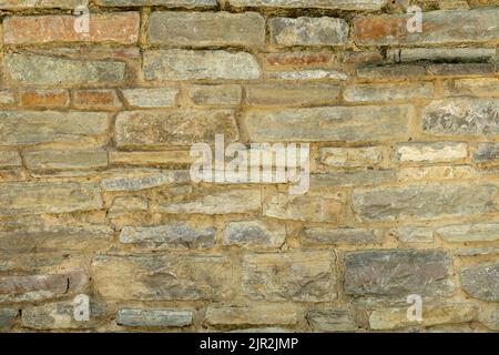 Solid yellow and beige stone wall. Stone background. Stock Photo
