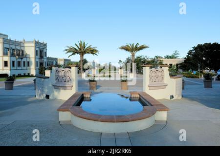 Reflective pool on the campus of the University of San Diego; walkway and palms located in front of the Immaculata Parish, San Diego California. Stock Photo