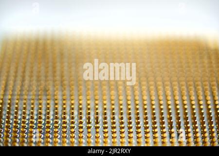 Microprocessor on white background. golden pins facing up. The concept of new technologies Stock Photo