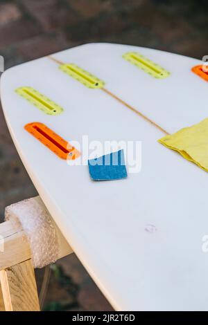 Rear shot of a surfboard with a small bump Stock Photo