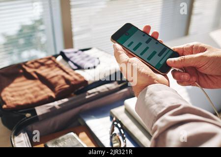 Hands of a man are writing a sms on a smartphone Stock Photo