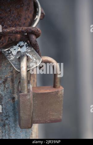 Two locked padlocks and rusty chain Stock Photo