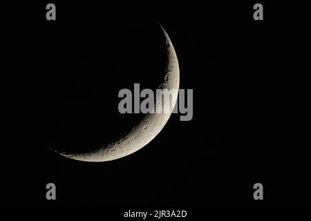 A mystic view of the half moon in the black space Stock Photo