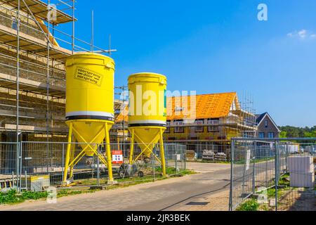 two Beamix cement towers at a construction site, Rucphen, The Netherlands, 6 may, 2022 Stock Photo