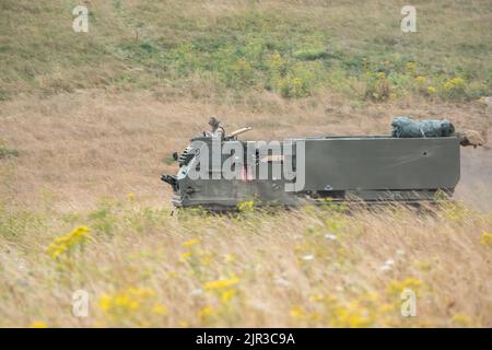 British army self propelled M270 Multiple Launch Rocket System (MLRS) in action on a military exercise Stock Photo