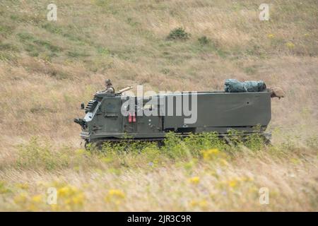 British army self propelled M270 Multiple Launch Rocket System (MLRS) in action on a military exercise Stock Photo