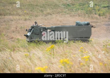 British army self propelled M270 Multiple Launch Rocket System (MLRS) in action on a military exercise Stock Photo