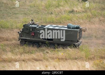 British army self propelled M270 Multiple Launch Rocket System (MLRS) in action on a military exercise Stock Photo