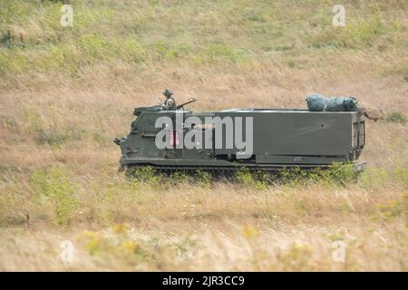 British army self propelled M270 Multiple Launch Rocket System (MLRS) in action on a military exercise Stock Photo