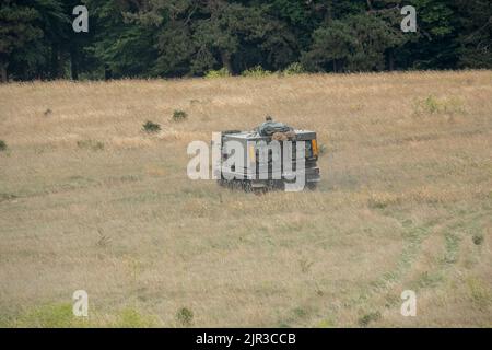 British army self propelled M270 Multiple Launch Rocket System (MLRS) in action on a military exercise Stock Photo