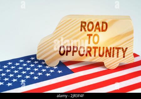 The concept of cargo transportation and logistics. On the US flag is a truck with the inscription - Road to Opportunity Stock Photo