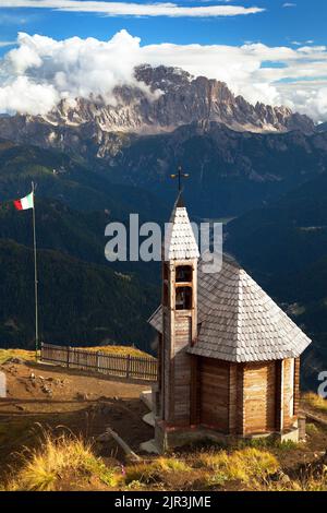 Small wooden church or chapel on the mountain top Col di Lana and Mount Civetta, Alps Dolomites mountains, Italy Stock Photo