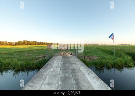 Dutch national flag upside down in farmland as a symbol of farmers anti government protest with message no farmer no food no future Stock Photo