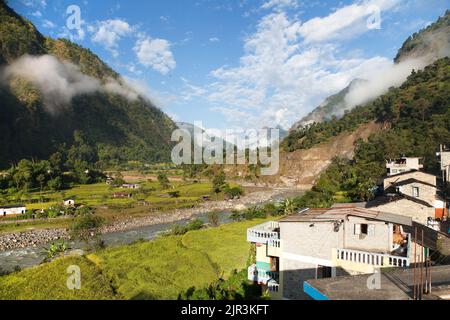 Beautiful village in western Nepal with Dhaulagiri Himal Stock Photo