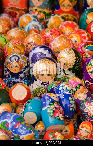 Close-up of colourfully hand painted Russian dolls on display and for sale at Old Town Market Square, Warsaw, Poland. Stock Photo