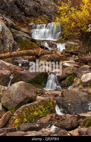 Small roadside waterfall along the San Juan Skyway in autumn, San Juan Mountains, Colorado Stock Photo