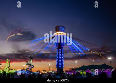 Lights on carnival rides at sunset, Delaware State Fair, Harrington, Delaware Stock Photo