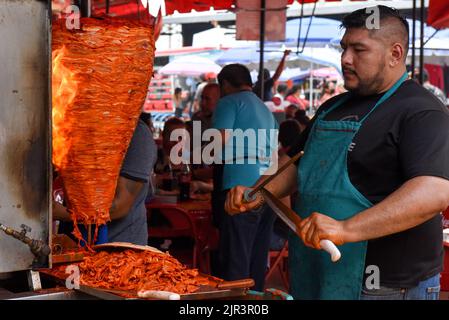 A man preparing shawarma at street market Stock Photo - Alamy