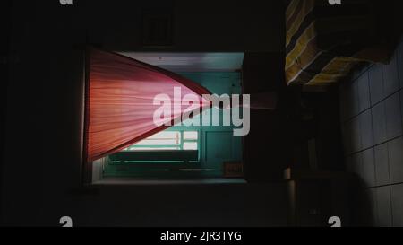 Thin white curtains light cream pink are used for light sun protection or blocking light from entering the room. Stock Photo