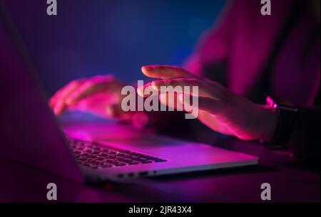 Female manager is using laptop. Computer and hands close up. Stock Photo