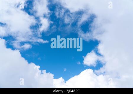 White clouds and blue sky beautiful background for postcard Stock Photo