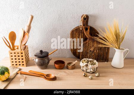a set of various kitchen utensils of a country house, a cottage on a wooden countertop. interior items. ecologically clean kitchen Stock Photo