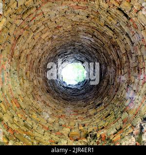 Old brick chimmey from indoor Stock Photo