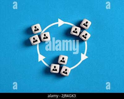 Team interaction, teamwork, joining forces with other business teams, assistance in completing tasks, coordination and sharing knowledge. Business mod Stock Photo