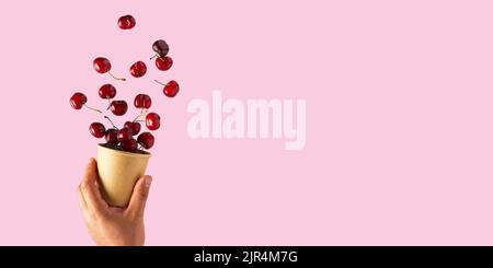 Set of falling ripe cherries. Banner design. Flying fruit as package design element. Stock Photo