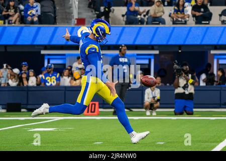 Los Angeles Rams punter Riley Dixon (11) throws a pass on a trick play in  the first half of an NFL football game against the Dallas Cowboys, Sunday,  Oct. 9, 2022, in