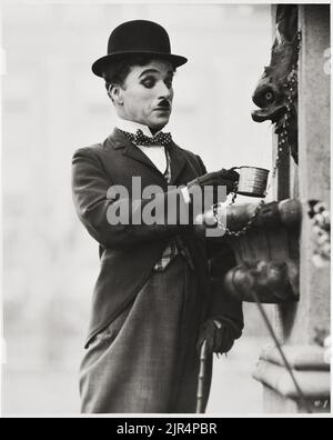 Charlie Chaplin in City Lights (United Artists, 1931). Movie scene. The Tramp outfit. Stock Photo