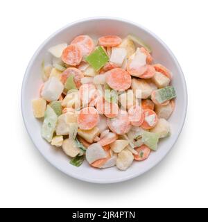 Bowl of frozen mixed vegetables shot from above isolated on white with path cut out Stock Photo