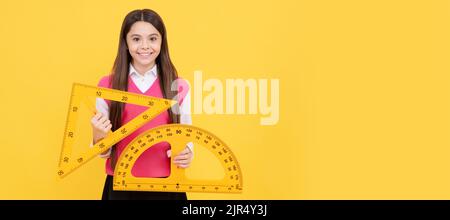 cheerful teen girl study math with protractor and triangle measuring size, back to school. Banner of school girl student. Schoolgirl pupil portrait Stock Photo