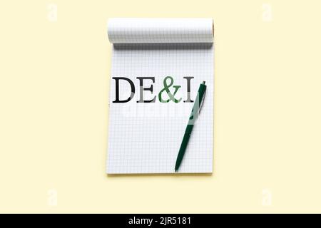 Notebook with abbreviation DE and I (diversity, equity, inclusion) on light background Stock Photo