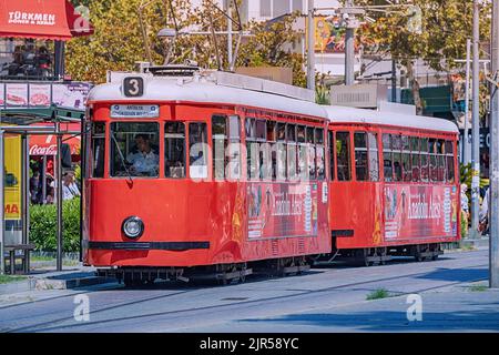 07 July 2022, Antalya, Turkey: Retro vintage tram line for tourists and locals leading to the old town centre. Stock Photo