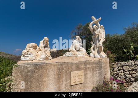 one of the 14 marble statues representing the Via Crucis or Way of the Cross run up Ghammar Hill opposite the Church of Ta' Pinu on Gozo Island Stock Photo