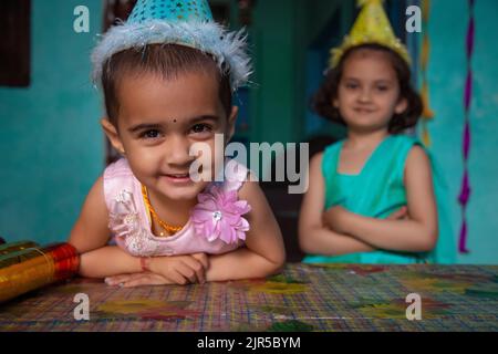 Close-up portrait of cute child with birthday cap Stock Photo