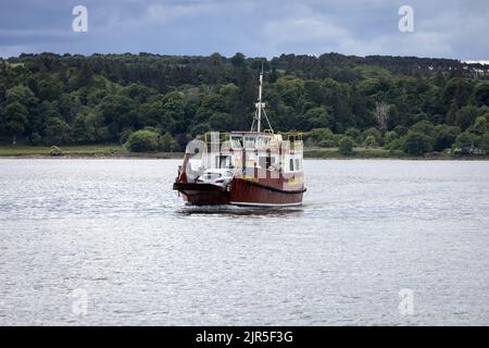 The Renfrew Rose ferry makes its way across the Cromarty Firth between Cromarty and Nigg Stock Photo